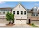 Charming townhome features a painted brick facade, attached garage, and well-maintained landscaping at 355 Niles Ct # 2, Marietta, GA 30060