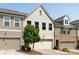 Charming townhome features a painted brick facade, attached garage, and well-maintained landscaping at 355 Niles Ct # 2, Marietta, GA 30060