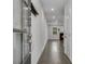 Inviting hallway featuring hardwood floors, leading to a bright living space with a fireplace at 355 Niles Ct # 2, Marietta, GA 30060