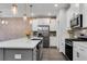 Modern kitchen featuring white cabinets, stainless steel appliances, and a large kitchen island at 355 Niles Ct # 2, Marietta, GA 30060