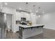 Bright kitchen featuring stainless steel appliances, white cabinets, and gray center island at 355 Niles Ct # 2, Marietta, GA 30060
