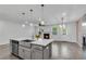 Kitchen island with stainless steel sink overlooks the living area with a fireplace at 355 Niles Ct # 2, Marietta, GA 30060