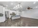 Open-concept living space featuring hardwood floors, an island, modern lighting and stainless steel appliances at 355 Niles Ct # 2, Marietta, GA 30060