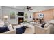 Bright living room featuring a fireplace, exposed brick accent wall, and open dining area at 355 Niles Ct # 2, Marietta, GA 30060