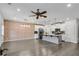 Spacious living area with open-concept kitchen featuring exposed brick and modern fixtures at 355 Niles Ct # 2, Marietta, GA 30060