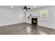 Cozy living room featuring a fireplace, windows, and hardwood floors for a warm ambiance at 355 Niles Ct # 2, Marietta, GA 30060