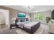 Modern main bedroom with brick accent wall, dark furniture, carpet floors, and natural light at 355 Niles Ct # 2, Marietta, GA 30060