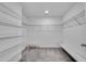 Large walk-in closet with carpet, ample shelving, seating, and great storage at 355 Niles Ct # 2, Marietta, GA 30060