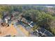 Aerial view of the townhome community surrounded by lush greenery at 4418 Chowning Way, Dunwoody, GA 30338