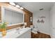 Stylish bathroom featuring a modern vanity, wood accent wall, and updated fixtures at 4418 Chowning Way, Dunwoody, GA 30338