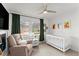Bright Bedroom featuring a crib, an armchair, and natural light at 4418 Chowning Way, Dunwoody, GA 30338