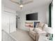 Bedroom with a TV, chair, ceiling fan, a closet, and lots of natural light at 4418 Chowning Way, Dunwoody, GA 30338
