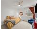 Bright bedroom with a ceiling fan, window, and a cozy chair at 4418 Chowning Way, Dunwoody, GA 30338