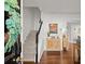 Inviting entryway with a view of the staircase and dining area with hardwood floors at 4418 Chowning Way, Dunwoody, GA 30338