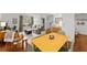 Open-concept living space with hardwood floors, large windows, and modern furnishings at 4418 Chowning Way, Dunwoody, GA 30338