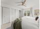 Bedroom featuring white walls, a ceiling fan, and a window with natural light at 4418 Chowning Way, Dunwoody, GA 30338