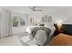 Light and airy main bedroom with a ceiling fan, decor headboards and natural light at 4418 Chowning Way, Dunwoody, GA 30338