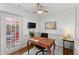 Office space featuring wood floors, a ceiling fan, and a view of the outdoors at 4418 Chowning Way, Dunwoody, GA 30338