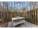 Outdoor patio with a modern table and bench seating, perfect for relaxing at 4418 Chowning Way, Dunwoody, GA 30338