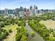 Panoramic aerial view of Luxe condo building in front of Piedmont Park and the city skyline at 222 12Th Ne St # 1508, Atlanta, GA 30309