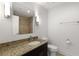 Bathroom featuring granite counter top, modern lighting, sink, and toilet at 222 12Th Ne St # 1508, Atlanta, GA 30309