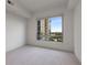 Empty bedroom featuring a bright, airy space with large window and plush carpet at 222 12Th Ne St # 1508, Atlanta, GA 30309