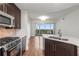 Bright kitchen with stone countertops and stainless steel appliances at 222 12Th Ne St # 1508, Atlanta, GA 30309