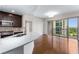 Bright kitchen boasts stainless steel appliances, stone countertops and hardwood floors at 222 12Th Ne St # 1508, Atlanta, GA 30309