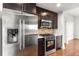 Stainless steel refrigerator complements dark cabinets in this modern kitchen at 222 12Th Ne St # 1508, Atlanta, GA 30309