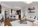 Inviting living room with modern decor, an open kitchen, and stylish furnishings at 222 12Th Ne St # 1508, Atlanta, GA 30309