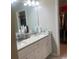 Bathroom features a double vanity, granite countertop, and a walk in closet at 243 Beau St, Lilburn, GA 30047