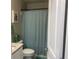 This bathroom features a shower and a standard toilet at 243 Beau St, Lilburn, GA 30047