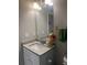 This bathroom features a granite countertop, a mirror and chrome fixtures at 243 Beau St, Lilburn, GA 30047