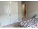This bedroom features carpet floors, double door closet, and a neutral paint color at 243 Beau St, Lilburn, GA 30047