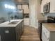 Well-equipped kitchen with island, stainless steel appliances and granite countertops at 243 Beau St, Lilburn, GA 30047