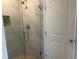 Beautiful tile shower with glass door, built-in niche and modern fixtures at 243 Beau St, Lilburn, GA 30047