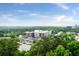 An aerial view shows the property's location surrounded by lush trees and nearby commercial buildings at 3300 Windy Ridge Se Pkwy # 1212, Atlanta, GA 30339