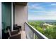 A private balcony with comfortable seating provides scenic views of the surrounding landscape and neighborhood at 3300 Windy Ridge Se Pkwy # 1212, Atlanta, GA 30339