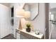 Hallway features modern console table with decor and a laundry closet at 3300 Windy Ridge Se Pkwy # 1212, Atlanta, GA 30339