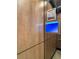 Modern hallway with electronic traffic updates and decorative Derby artwork at 3300 Windy Ridge Se Pkwy # 1212, Atlanta, GA 30339