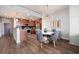 Modern kitchen with dining area featuring stylish chairs and hardwood flooring at 3300 Windy Ridge Se Pkwy # 1212, Atlanta, GA 30339