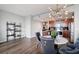 An open-concept living area and kitchen features stylish decor, modern lighting, and sleek appliances at 3300 Windy Ridge Se Pkwy # 1212, Atlanta, GA 30339