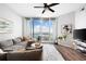 Comfortable living room featuring a plush sofa, balcony access, and plenty of natural light for relaxation at 3300 Windy Ridge Se Pkwy # 1212, Atlanta, GA 30339