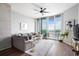 Cozy living room with modern furnishings, large windows, and access to a private balcony with scenic views at 3300 Windy Ridge Se Pkwy # 1212, Atlanta, GA 30339