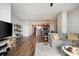 Open concept living room featuring hardwood floors, modern decor, and views into kitchen at 3300 Windy Ridge Se Pkwy # 1212, Atlanta, GA 30339