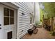Charming backyard entrance with pea gravel, garden bed, and a dog door for added convenience at 676 Juneberry Se Ln, Atlanta, GA 30316