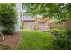Lush backyard featuring a pergola, vibrant green lawn, and privacy fencing at 676 Juneberry Se Ln, Atlanta, GA 30316
