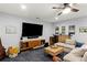 Finished basement area features a TV, wine rack, wooden accents, plush carpeting, and cozy seating at 676 Juneberry Se Ln, Atlanta, GA 30316
