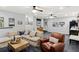Basement living area features plush carpeting, stylish decor, comfortable seating, and bright lighting at 676 Juneberry Se Ln, Atlanta, GA 30316