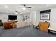 Spacious basement living area features a large television, plush carpeting, and stylish decor at 676 Juneberry Se Ln, Atlanta, GA 30316